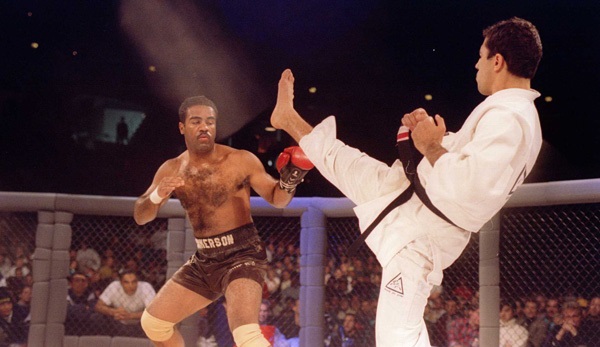 Jiu-Jitsu black belt Royce Gracie kicks at cruiserweight boxer Art Jimmerson during a 1st round match in the Ultimate Fighter Championships in Denver, Colorado. Gracie went on to win the match and eventually the championship. Mandatory Credit: Markus Boes